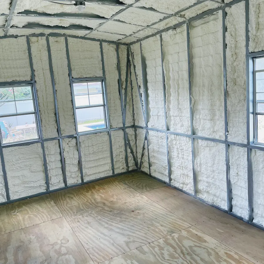 Closed-cell spray foam insulation applied to wall cavities in a residential project in Midlothian